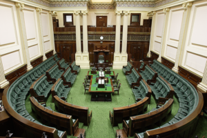 Photo of an empty Victorian Legislative Assembly Chamber.